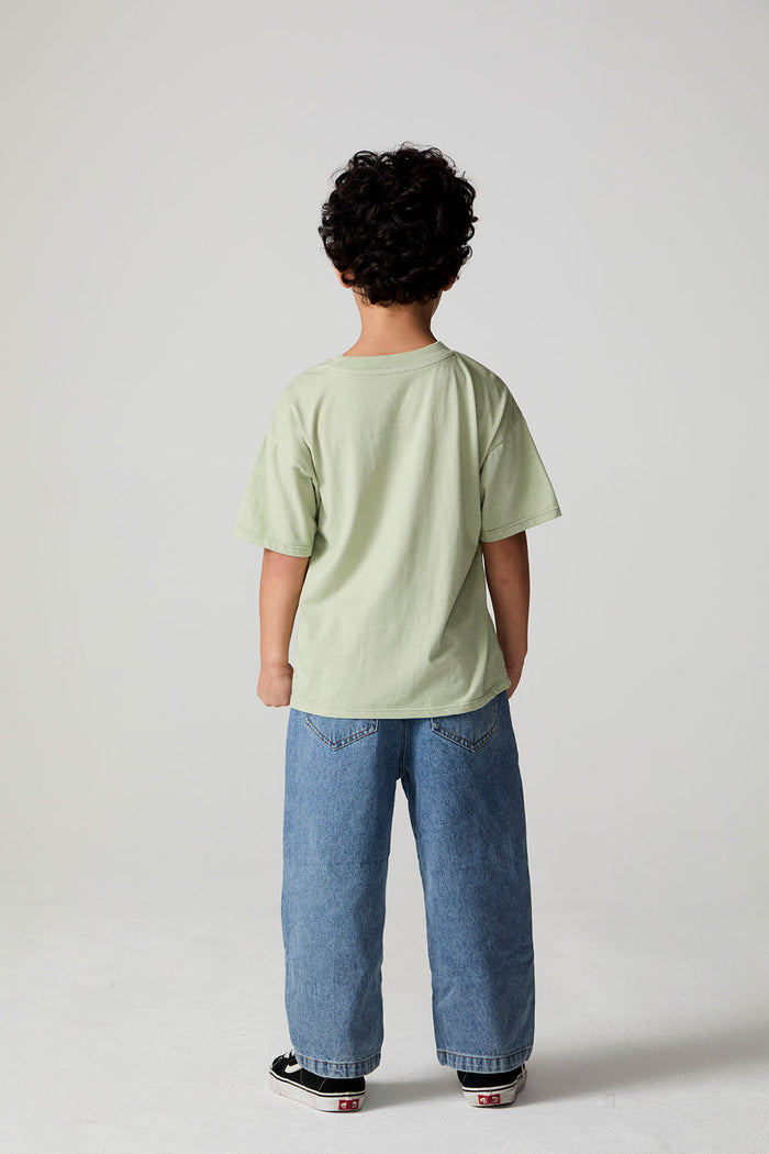 Full body back view of a boy wearing the Chaser Western Time Tee on a neutral background