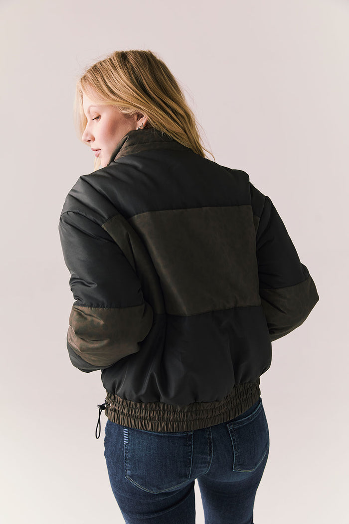 Back view of Chaser Brand Whistler Leopard and True Black Puffer Jacket with contrast panels and elasticized hem