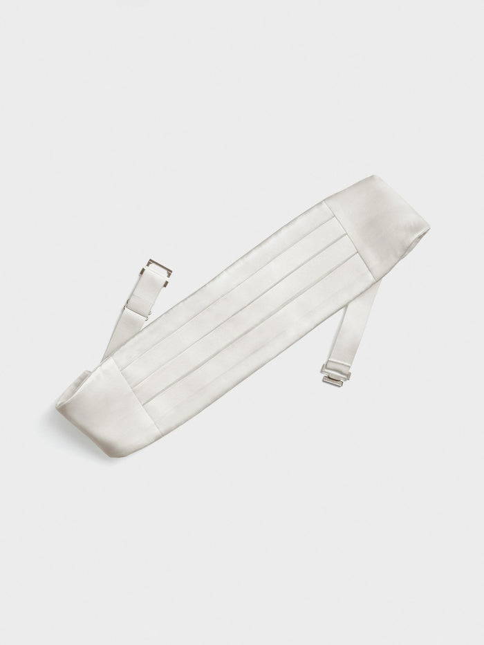 White satin cummerbund with horizontal pleats, straps extended, laid flat