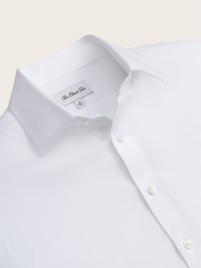 Close-up of white stretch cotton dress shirt collar and brand label