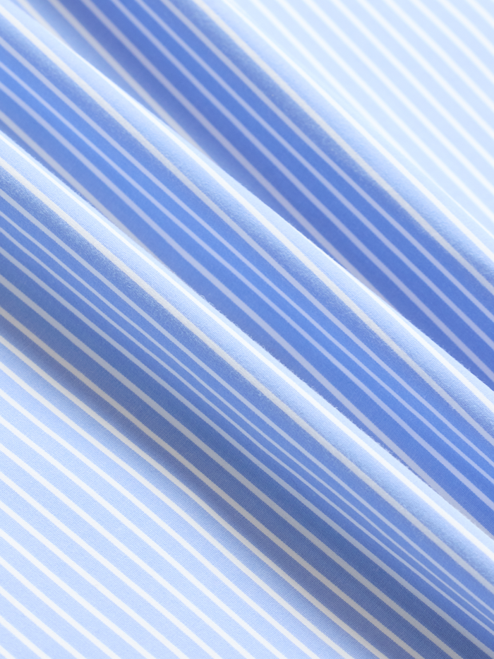 Close-up of light blue and white wide stripe fabric texture