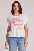 Front view of a woman wearing the Chaser Willie Nelson Fan Club Tee on a neutral background with arms at sides