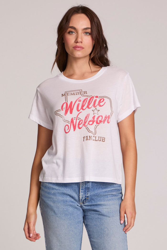 Front view of a woman wearing the Chaser Willie Nelson Fan Club Tee on a neutral background with arms at sides