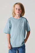 Front view of a boy wearing the Chaser Willie Nelson Rider Tee on a neutral background