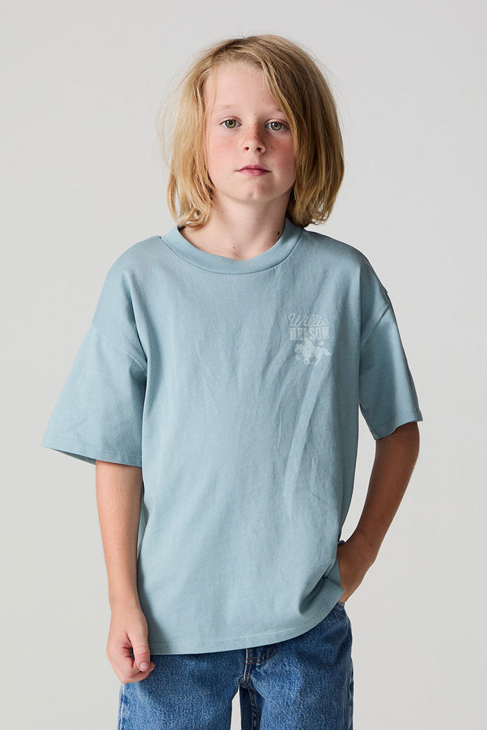 Front view of a boy wearing the Chaser Willie Nelson Rider Tee on a neutral background