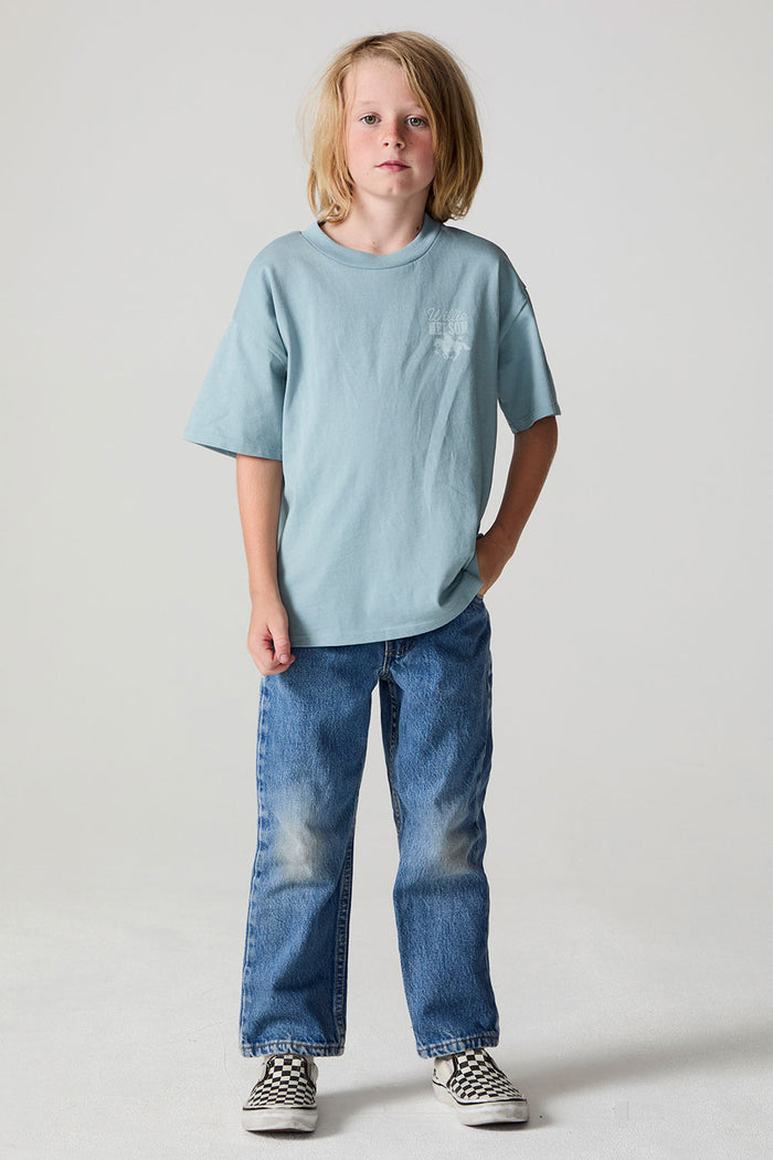 Full body front view of a boy wearing the Chaser Willie Nelson Rider Tee on a neutral background