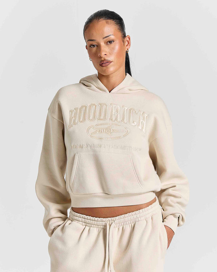Displays a model wearing the Stone 'Hoodrich' branded women's Aegis Full Tracksuit