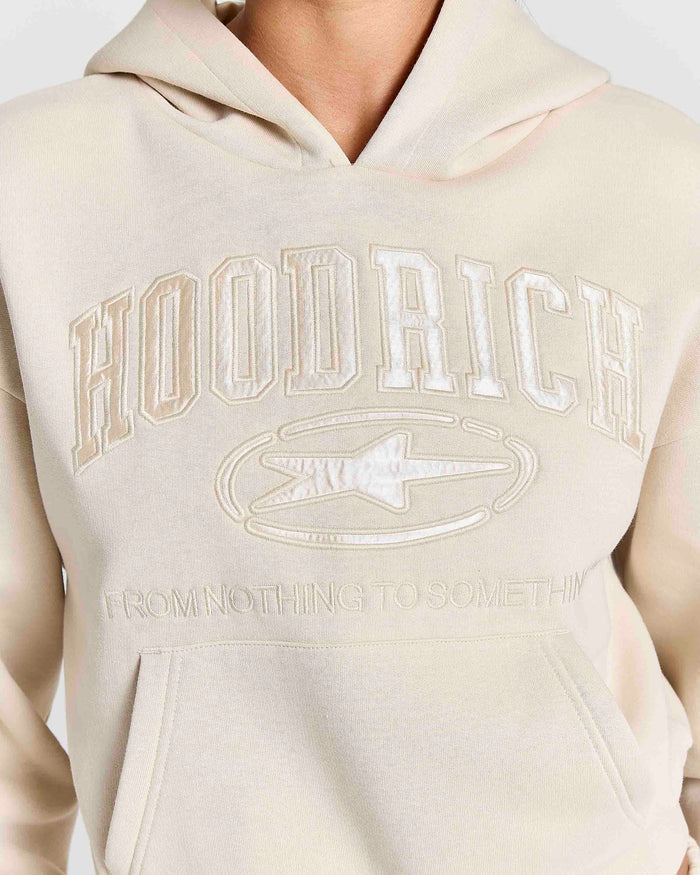 Displays a model wearing the Stone 'Hoodrich' branded women's Aegis Full Tracksuit