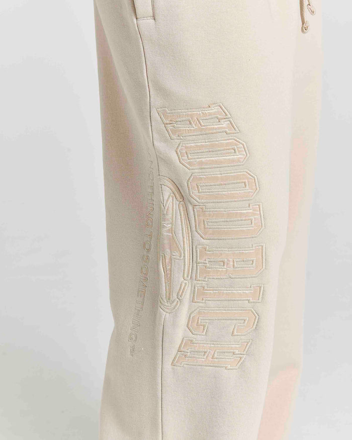 Displays a model wearing the Stone 'Hoodrich' branded women's Aegis Full Tracksuit