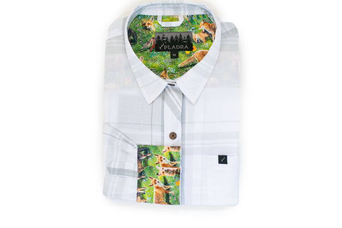 Pladra Women's Breeze Shirt- Spring White, with colorful fox and forest print on inner collar and placket, folded neatly.