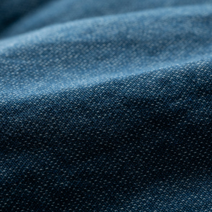 Close-up of blue Biscayne Blue Twill fabric showcases detailed weave texture and subtle folds, as featured in the Women's Cascade Shirt.
