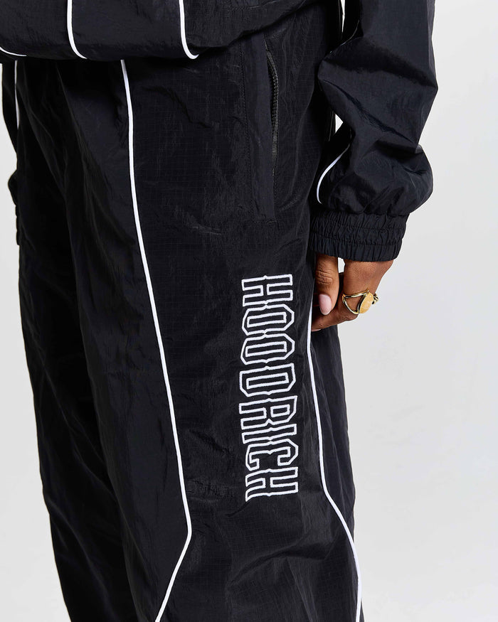 Black tracksuit with 'Hoodrich' branding on a white background