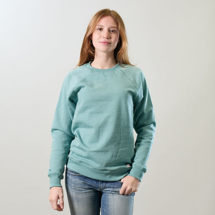 Women's Crew Neck Sweatshirt in Bermuda Green Heather, worn with blue jeans.