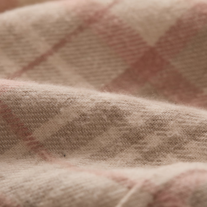 A close-up of the Women's Every Day Elite Flannel Shirt in Lighthouse White, showing its soft heavyweight brushed cotton texture and fine fibers, with a subtle plaid pattern for a cozy, stylish look.