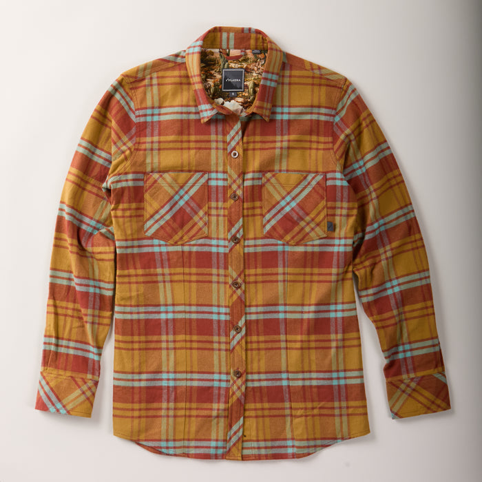 The Women's Every Day Flannel Shirt–Cottonwood Orange, made from premium Portuguese cotton flannel, features a mustard yellow, red, blue, and white plaid pattern with two chest pockets with button flaps.