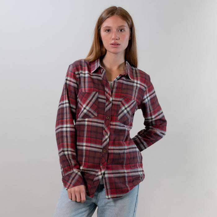 Young woman in a Pladra Women's Every Day Flannel Shirt - Harvest Red and light blue jeans stands against a plain background.