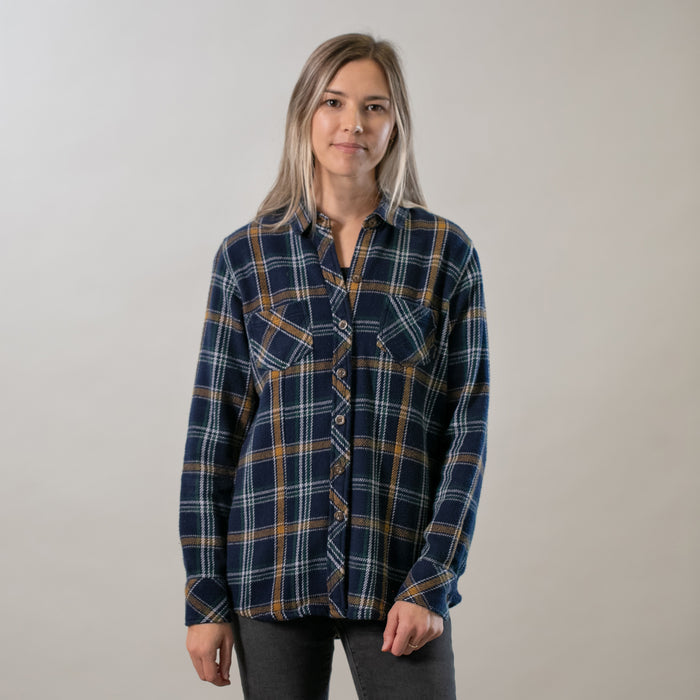Woman with straight blonde hair wears Pladra's Women's Fireside Flannel- Feather Blue against a light background.