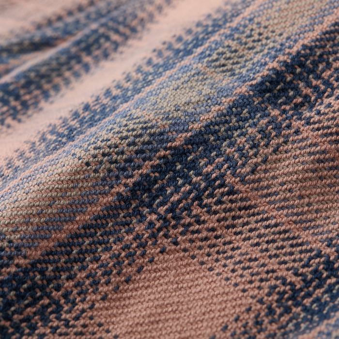 Close-up of Pladra's Women's Fireside Flannel in Lily Pink, featuring a blue and pink plaid cotton pattern.
