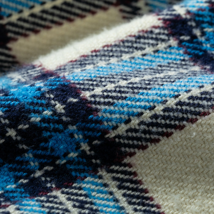Close-up of Pladra Women's Fireside Flannel in Tahoe Tan, made with soft organic cotton and checkered stripes.