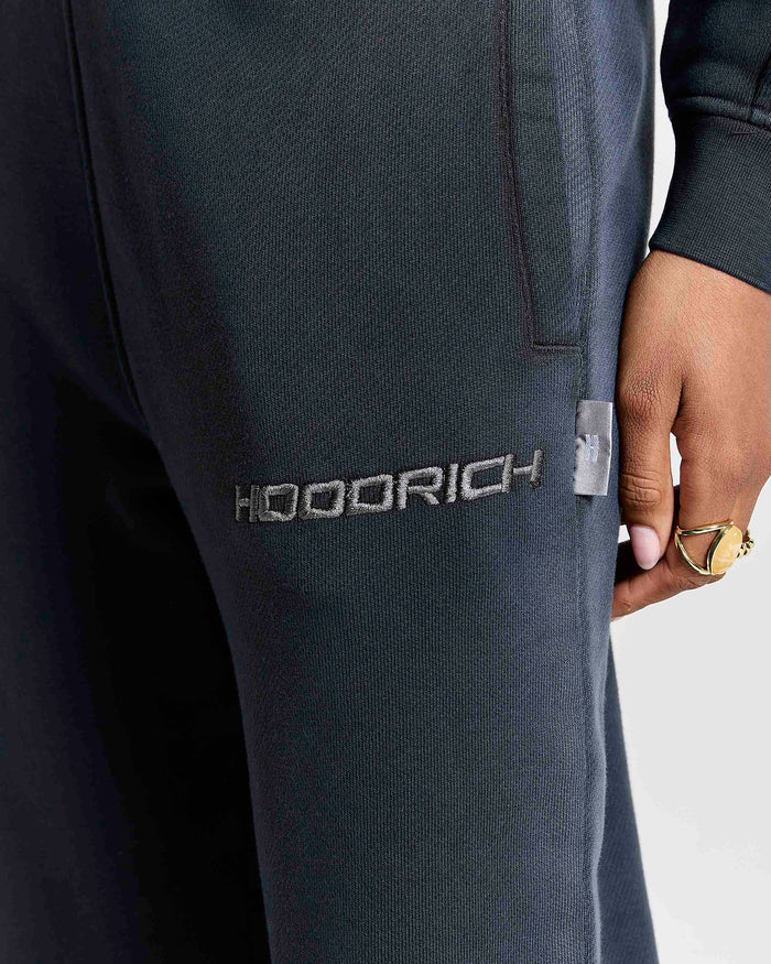Gray sweatpants with 'HOODRICH' branding on a white background
