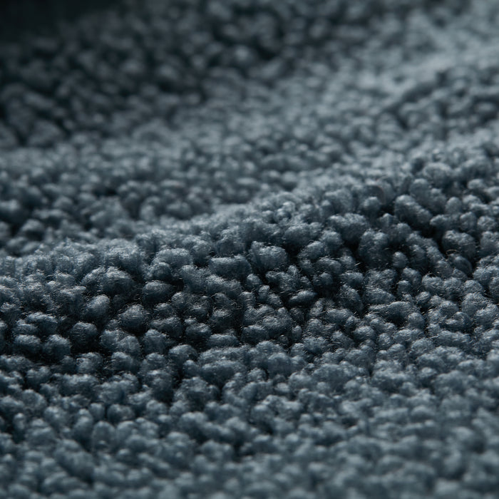 Close-up of the Women's Jenner Sherpa Fleece in Atlantic Blue, featuring a soft, textured recycled polyester fabric with a plush, bumpy surface that highlights its fluffy and cozy appeal.