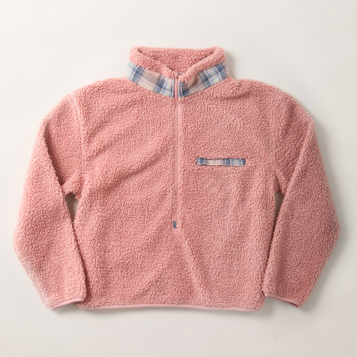The Women's Jenner Sherpa Fleece in Coral Pink features a half-zip front, long sleeves, and a plaid flannel-lined collar and pocket. Made from recycled polyester fleece and shown laid flat on a white background.