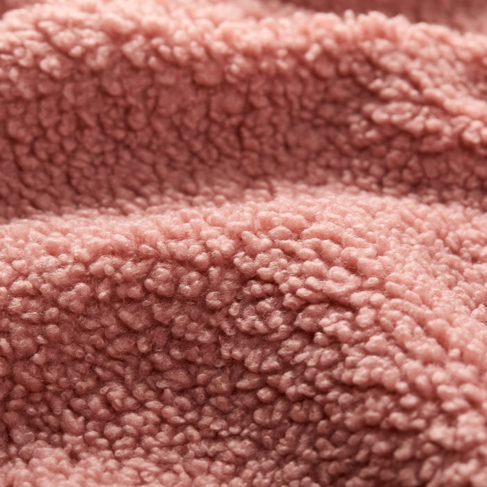 Close-up of Women's Jenner Sherpa Fleece in Coral Pink, highlighting its textured, fluffy surface and cozy look—crafted from recycled polyester fleece for warmth and sustainability.