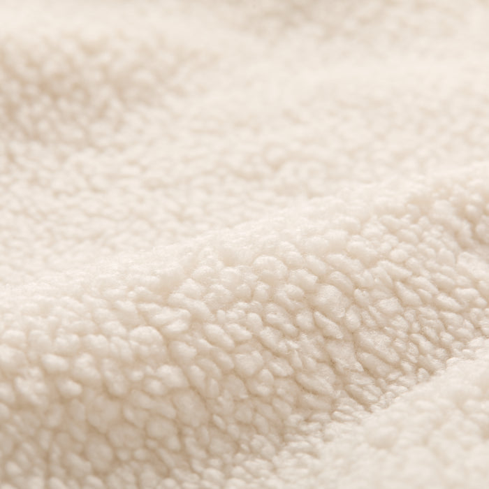 Close-up of Pladra Women's Jenner Sherpa Fleece in Oatmeal White, featuring soft recycled polyester and a fluffy texture.