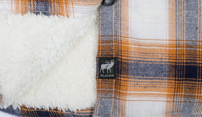 Pladra Women's Northwood Sherpa Insulated Flannel Jacket in Peak White with fleece lining and moose label.