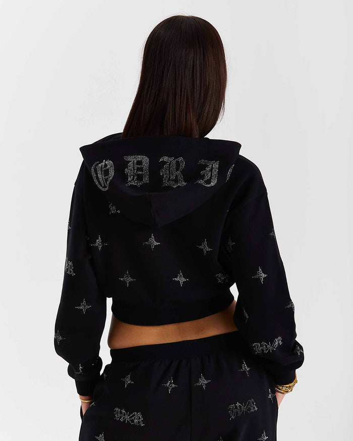 Person wearing a black hoodie with branding on the back against a white background