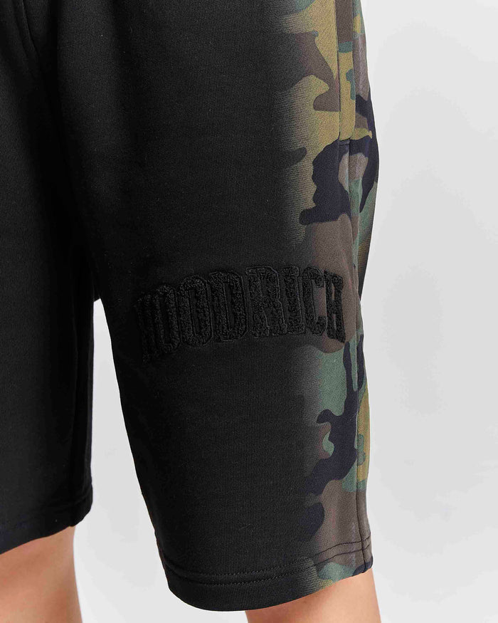 Displays a model wearing the Black camo 'Hoodrich' branded women's Shade Matching Shorts Set
