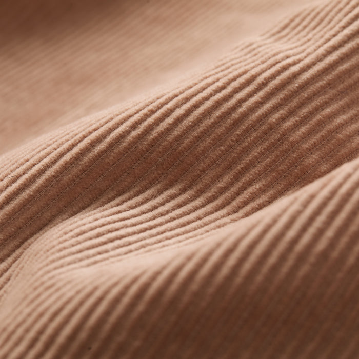 Close-up of Pladra Women's Stinson Jacket in Oak Tan, highlighting its textured corduroy fabric and wavy folds.