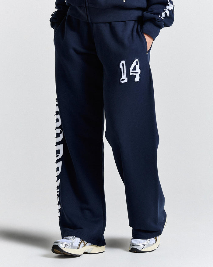 Navy blue tracksuit with number 14 on a light gray background