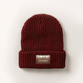 Woodsman Heavyweight Cuff Beanie in Burgundy Red, a knit beanie with a folded brim and a tree patch reading PLADRA. Made in the USA.