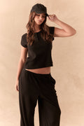Black henley tee with button neckline and slim fit.