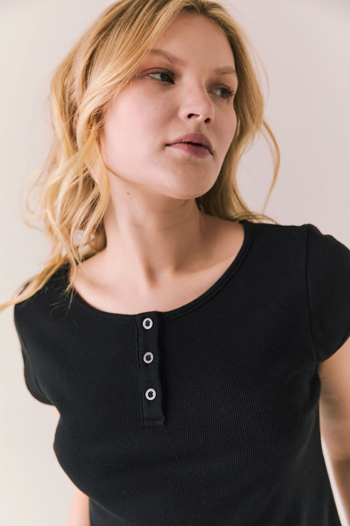 Black henley tee with button neckline and slim fit.