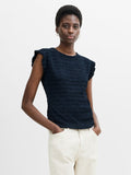 A woman wearing a Navy Blue Textured Top features a crew neck, frilled cap sleeves and back button fastening.