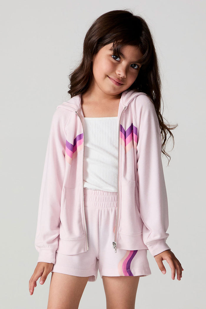Front view of a girl wearing the Chaser Zip Up Begonia Hoodie on a neutral background